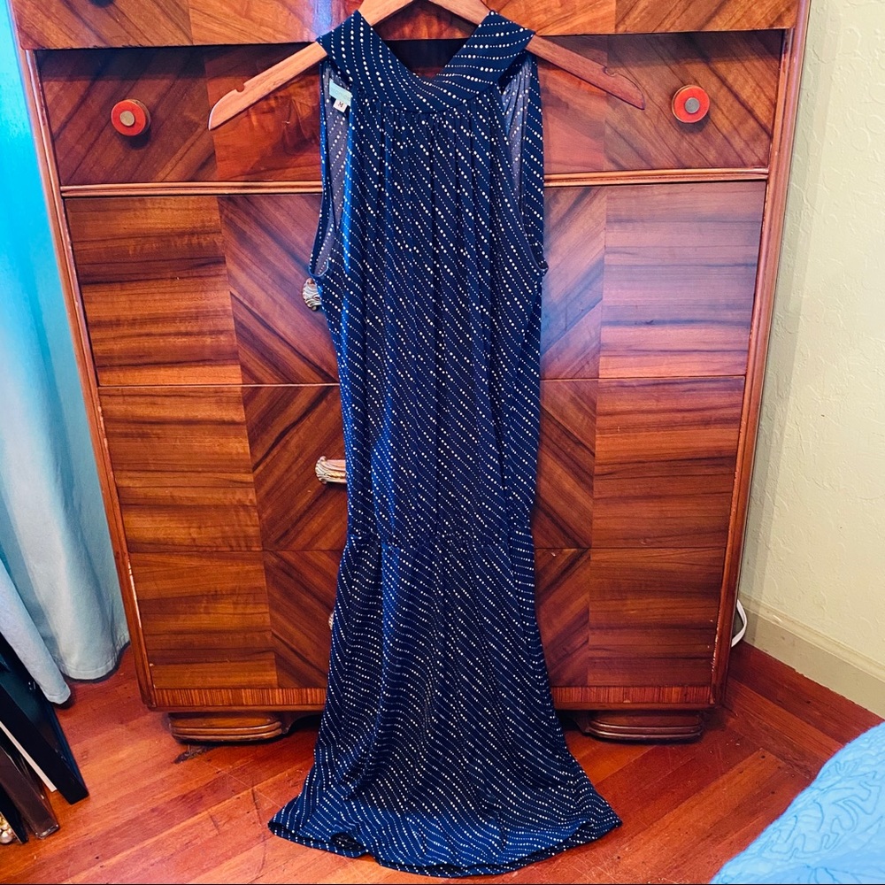 Flirty navy dress with bow tied in back of neck